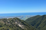 View of an urban area at the mouth of a river from mountains above