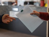 handing over a document